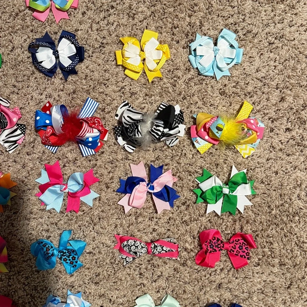 Girls bundle of bows and clips an assortment of sizes shapes and colors
